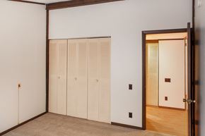 Orleans apartment for rent - a bedroom with white walls and a door to a closet