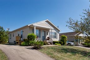 Cincinnati apartment for rent - a house with a driveway and a car parked in front of it