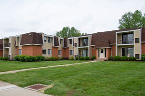 Mt. Orab apartment for rent - an apartment building with a green lawn and a sidewalk
