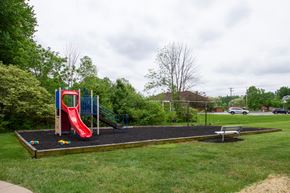 Mt. Orab apartment for rent - a playground with a slide and a picnic table in a yard