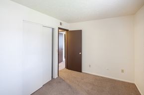 Mt. Orab apartment for rent - a bedroom with a closet and a door to a hallway