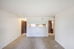 Georgetown apartment for rent - an empty living room with white walls and a white counter top