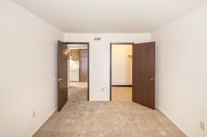 Georgetown apartment for rent - a bedroom with two doors and a carpeted floor