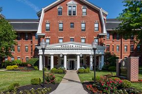 Cincinnati apartment for rent - a large brick building with a sidewalk in front of it