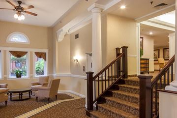 Cincinnati apartment for rent - a lobby with a staircase and a living room with furniture