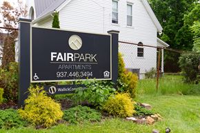 Sardinia apartment for rent - a sign for fair park apartments in front of a house