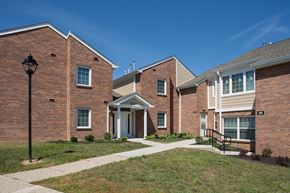 Independence apartment for rent - a brick building with a sidewalk in front of it