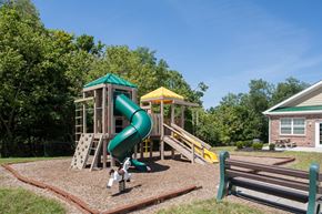 Independence apartment for rent - a playground with a slide and playset in front of a house