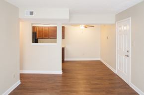 Dry Ridge apartment for rent - an empty living room with wood flooring and white walls