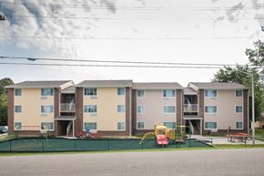 Dry Ridge apartment for rent - an image of an apartment building with a playground