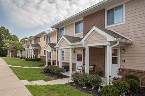 Dry Ridge apartment for rent - a row of houses with a sidewalk and grass
