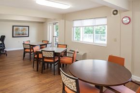 Ludlow apartment for rent - a dining room with tables and chairs and a clock on the wall