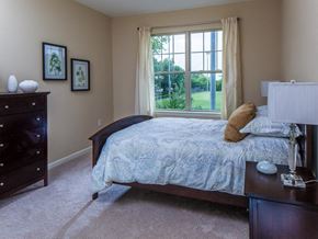 Maplewood apartment for rent - a bedroom with a bed and a window