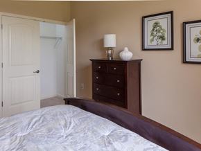Maplewood apartment for rent - a bedroom with a bed and a dresser and a closet