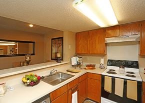 Arlington apartment for rent - a kitchen with a sink and stove and a counter top