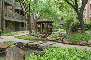 Dallas apartment for rent - a garden with a gazebo in the middle of a courtyard