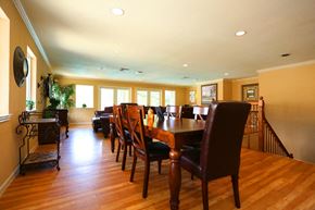 Houston apartment for rent - a large dining room with a wooden table and chairs
