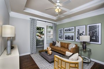 Indianapolis apartment for rent - a living room with a couch and a ceiling fan