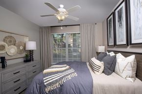 Indianapolis apartment for rent - Indianapolis Lake Clearwater Apartments bedroom with large window and ceiling fan