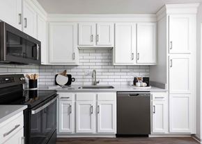 Louisville apartment for rent - Hurstbourne Grand Apartments Louisville modern kitchen with slate appliances and white cabinetry