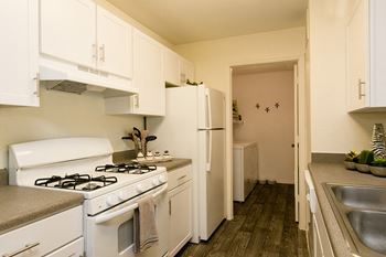 Open kitchen with breakfast bar and pantry