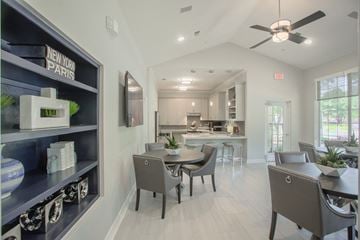 Plano apartment for rent - a dining room with a table and chairs and a kitchen