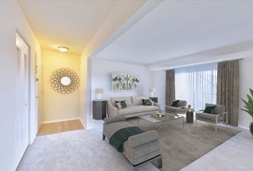 Fairfax apartment for rent - a living room with a couch and a table