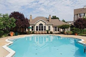 Sterling apartment for rent - a large swimming pool with a house in the background