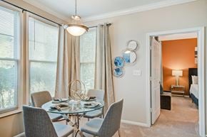 Sterling apartment for rent - a dining room with a glass table and chairs
