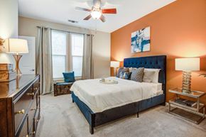 Sterling apartment for rent - a bedroom with a bed and a ceiling fan