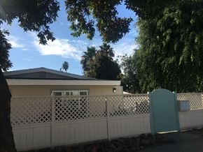 San Diego apartment for rent - a house with a white fence in front of it