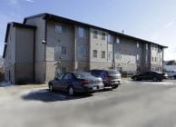 Milwaukee apartment for rent - A car is parked in front of a building.