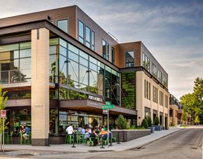 Grand Rapids apartment for rent - a group of people sitting outside of a building
