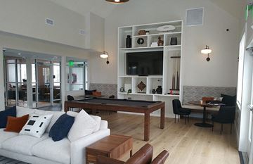 Plymouth apartment for rent - A living room with a white couch and a wooden coffee table.
