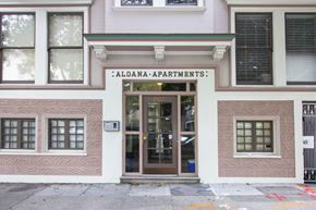 San Francisco apartment for rent - The front of a building with the name "Aldana-Apartments" on the sign above the door.