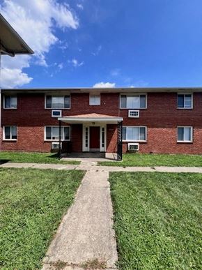 Columbus apartment for rent - A red brick building with a white door and windows.
