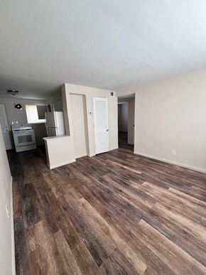 Columbus apartment for rent - A room with wooden flooring and white walls.