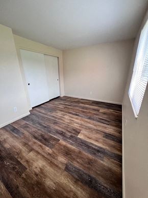 Columbus apartment for rent - A room with a wooden floor and a white door.