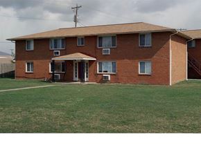 Columbus apartment for rent - A red brick house with a white door and windows.