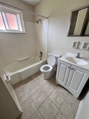 Columbus apartment for rent - A white bathroom with a toilet, sink, and bathtub.